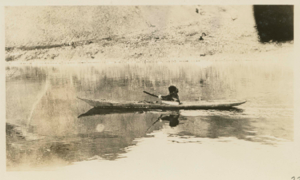 Image of Ah-now-ka (Aunakaq) in Kayak